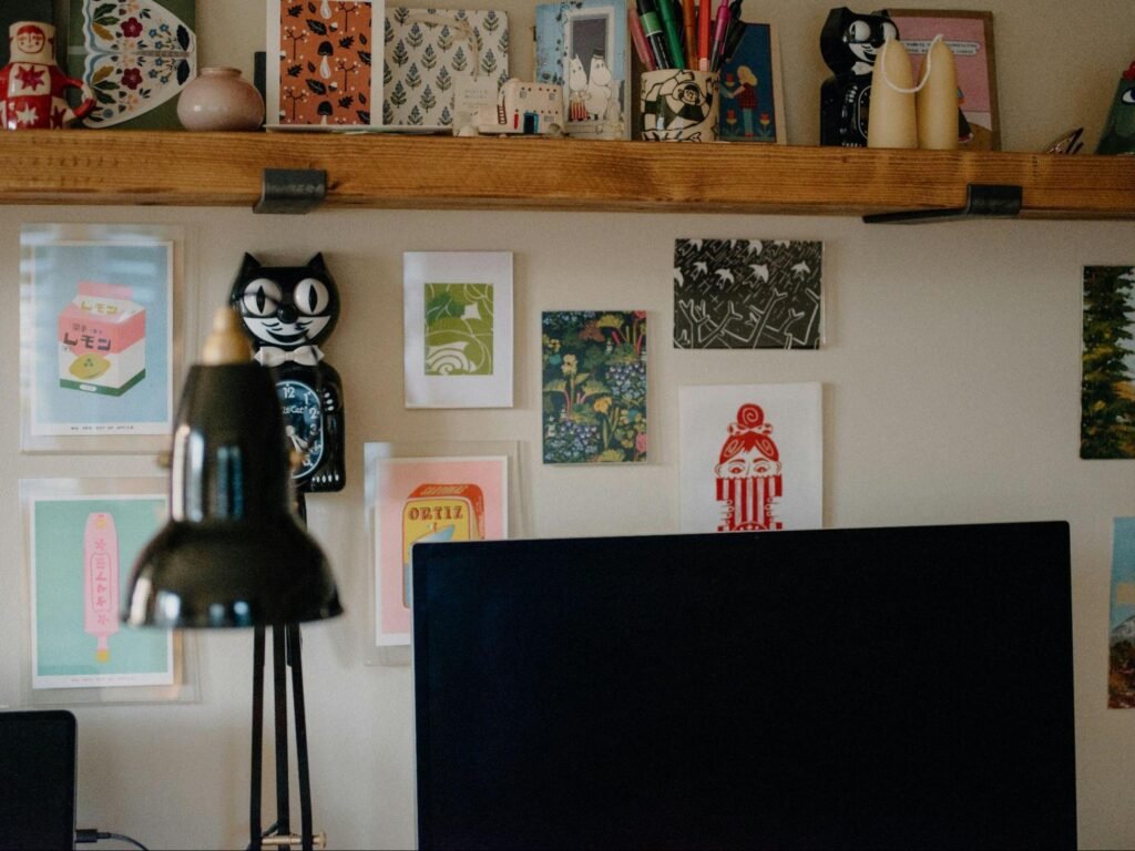 Home workspace with wall art, shelves, and personal objects reflecting adaptable storage and modern personal space