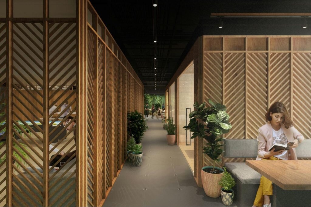 Modern coworking space featuring modular wooden partitions, indoor plants, and flexible seating designed for temporary and shared offices